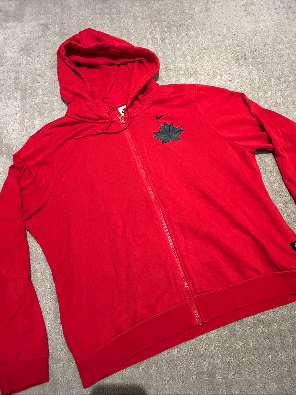 Nike Red zip up hoodie with Black Canada maple leaf Logo. EUC!